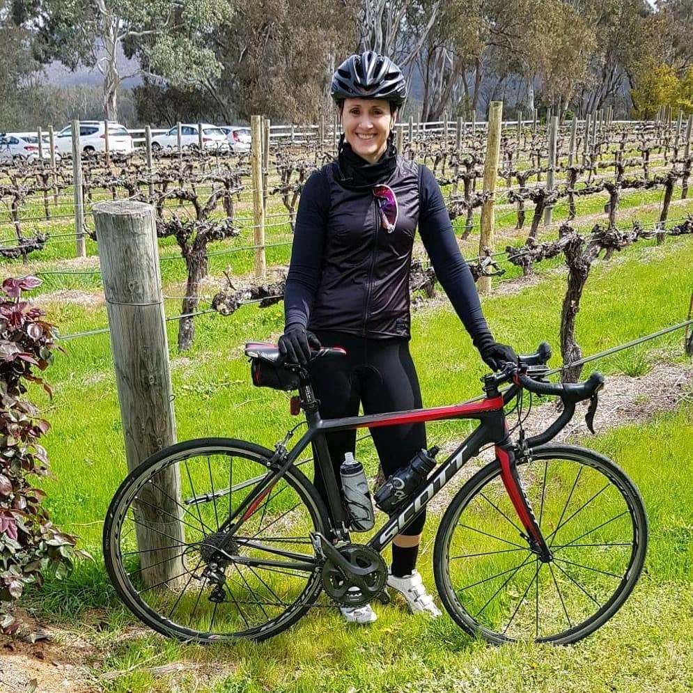 Rose Sutera, qualified nutritionist and aerobics instructor, with her road bike at a Victorian vineyard